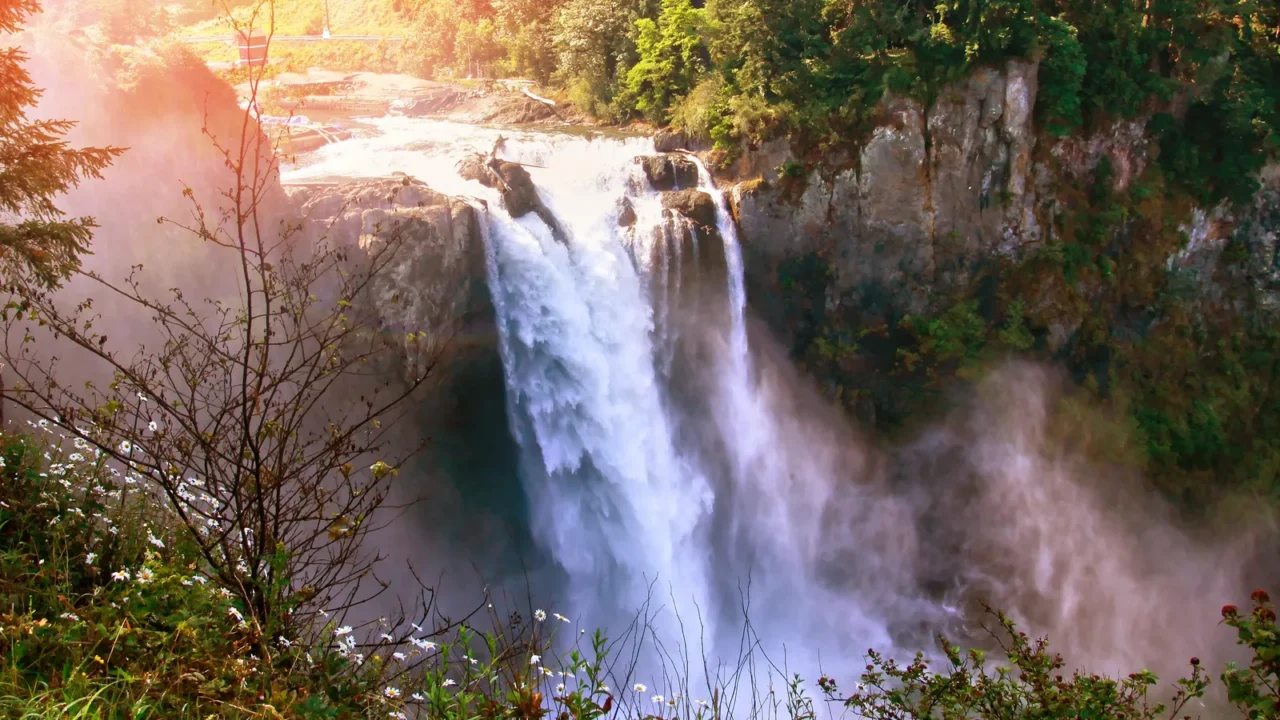 morning sunrise over snoqualmie falls in washington state