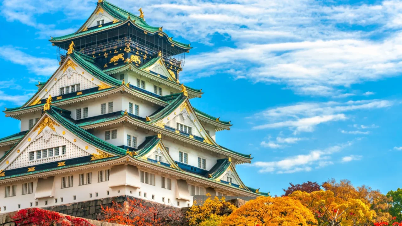 osaka castle in osaka with autumn leaves japan