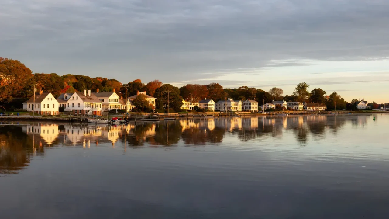 panoramic view of residential homes by the mystic river during