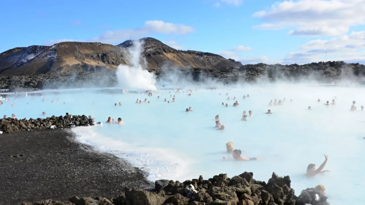 people bathing in the blue lagoon in iceland