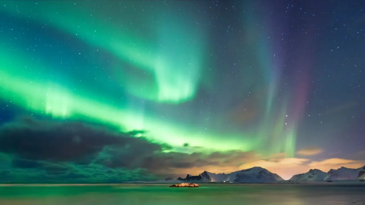 real magic of northern lights  norwegian fjord with snow
