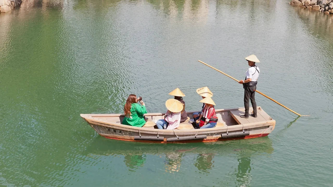 ride on traditional boat in takamatsu castle japan