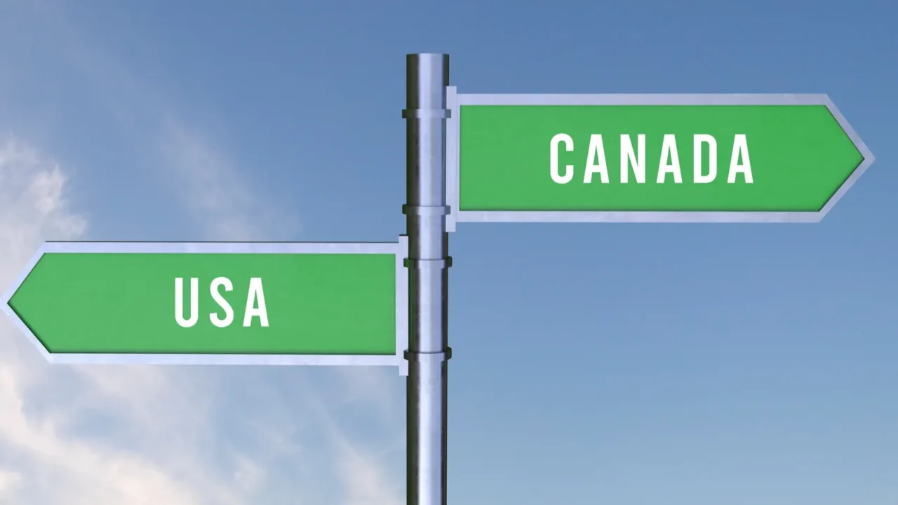 sign indicating the direction of the borders between two countries