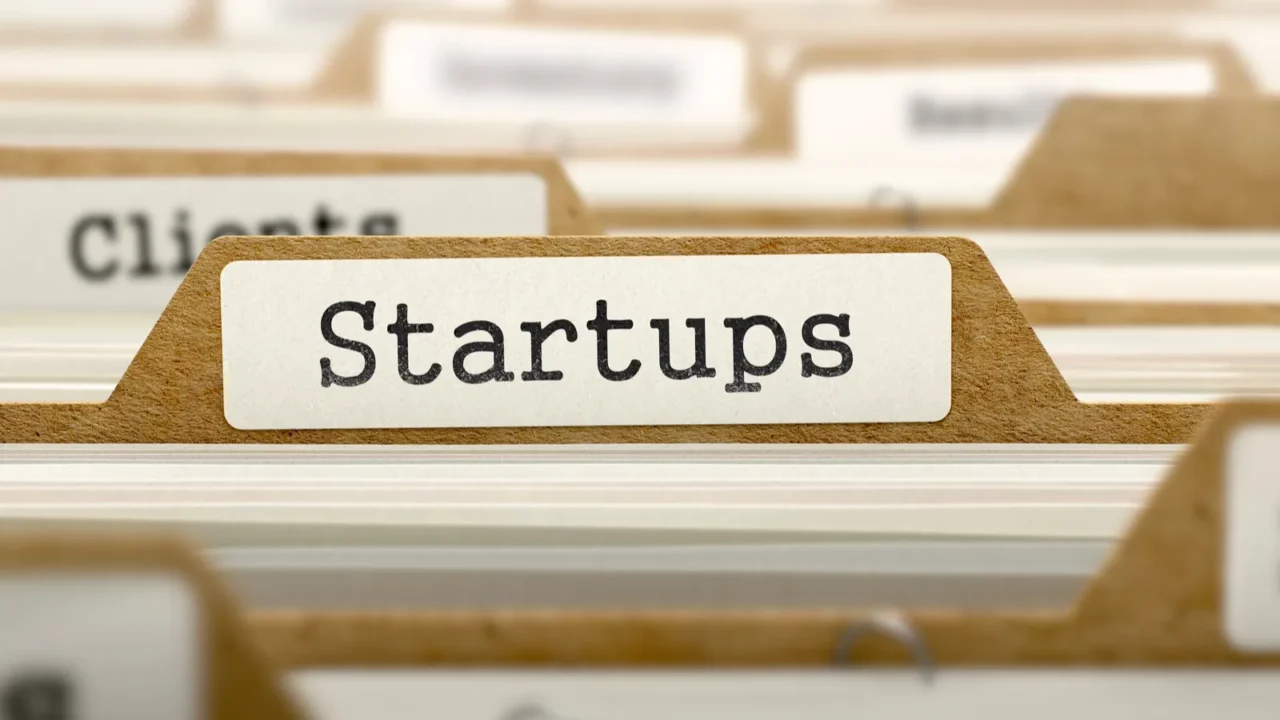 startups concept with word on folder