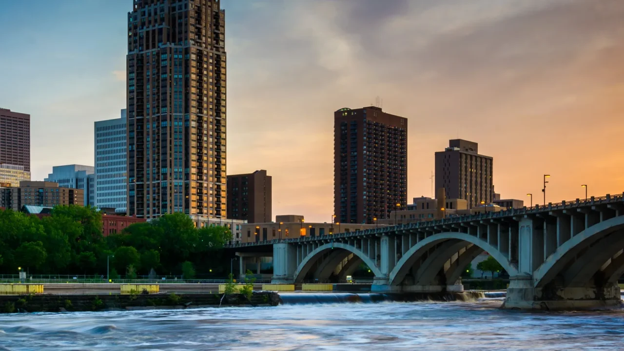 sunset over the minneapolis skyline and mississippi river in mi