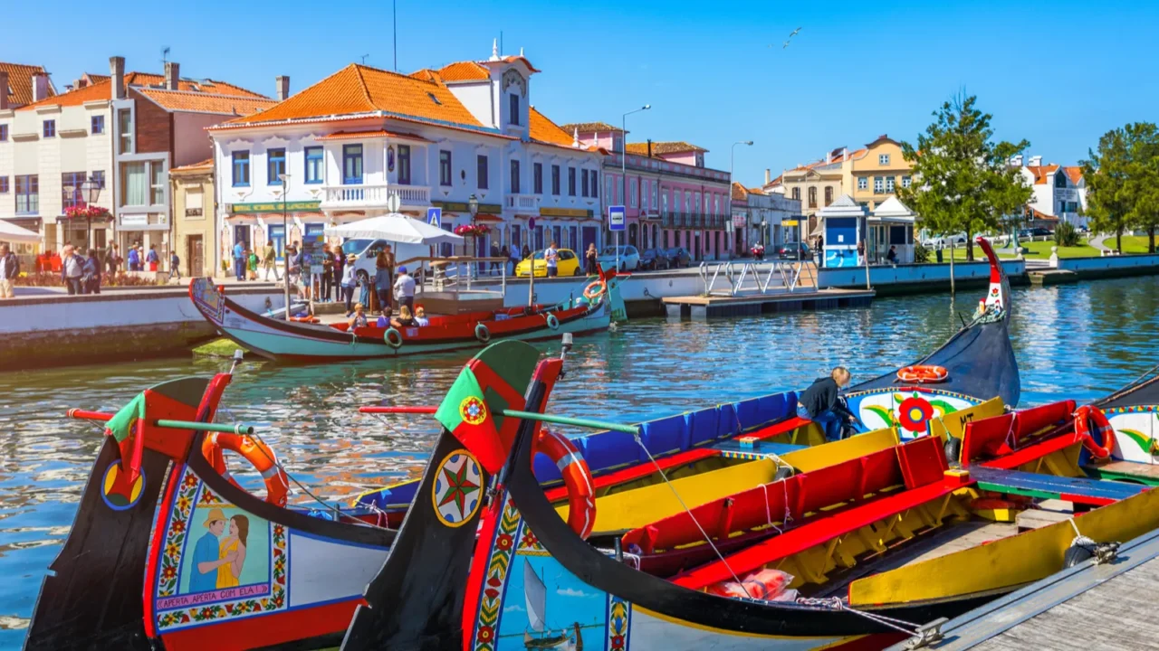 traditional boats on the canal in aveiro portugal colorful mol
