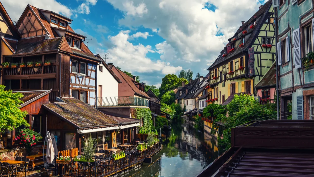 tranquil canals with reflections in the pretty town of colmar