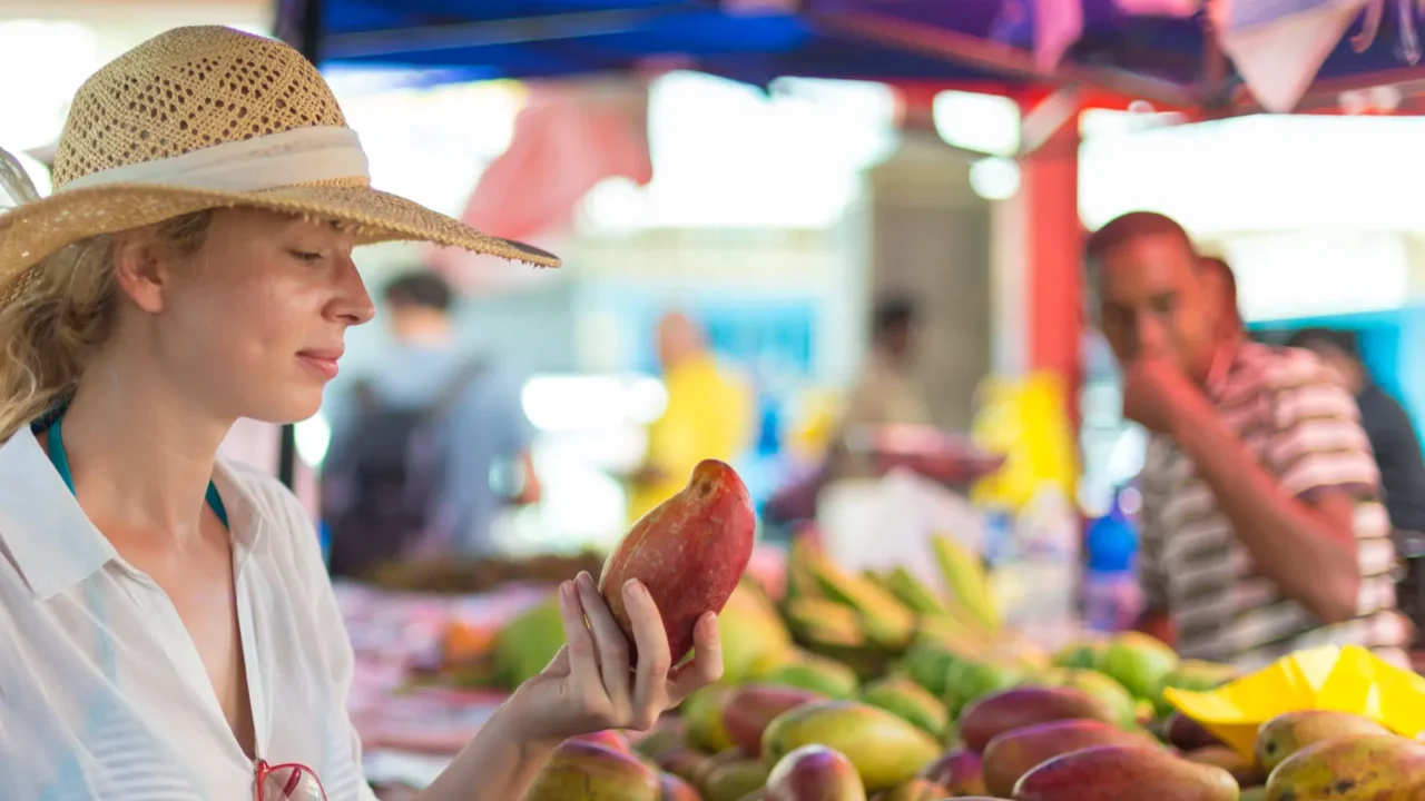 traveler shopping on traditional victoria food market seychelles