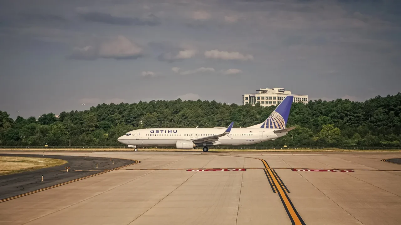 United Airlines plane departure in airport.
