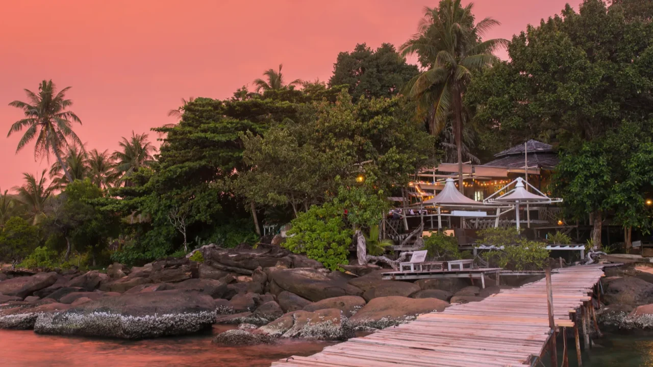 wooden pier to a tropical island resort on koh kood