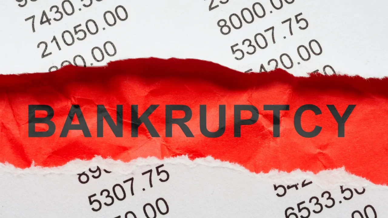 bankruptcy concept bank statements and crumpled paper