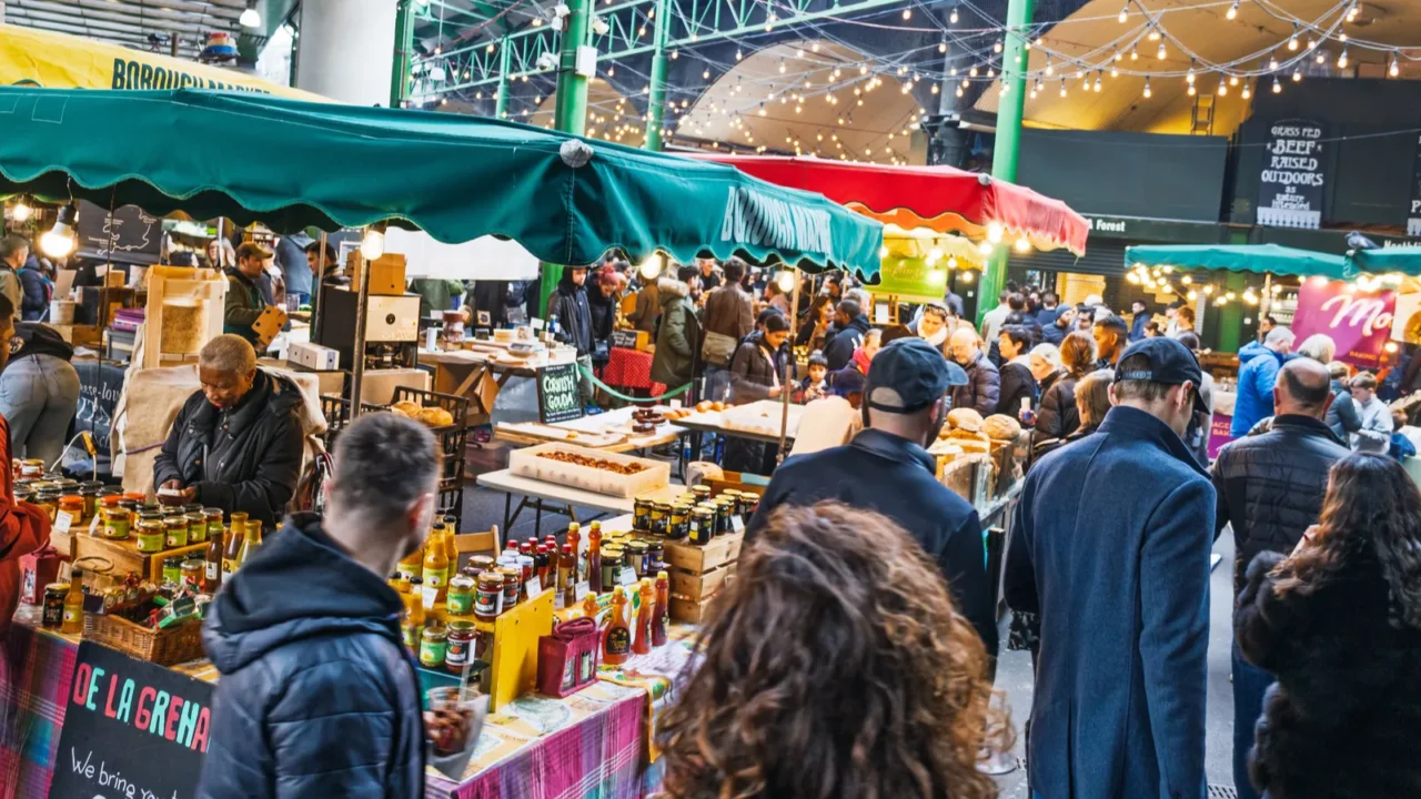 bustling borough market packed with shoppers enjoying fresh food stalls
