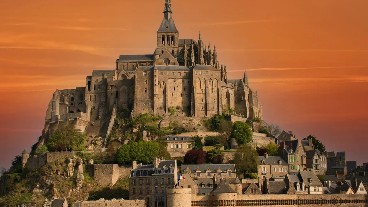 clouds over mont saint michel abbey normandy france