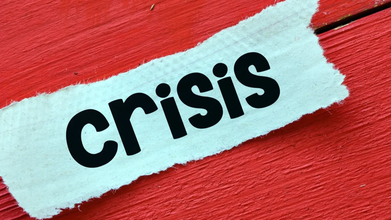 crisis word crisis written on a piece of paper economic