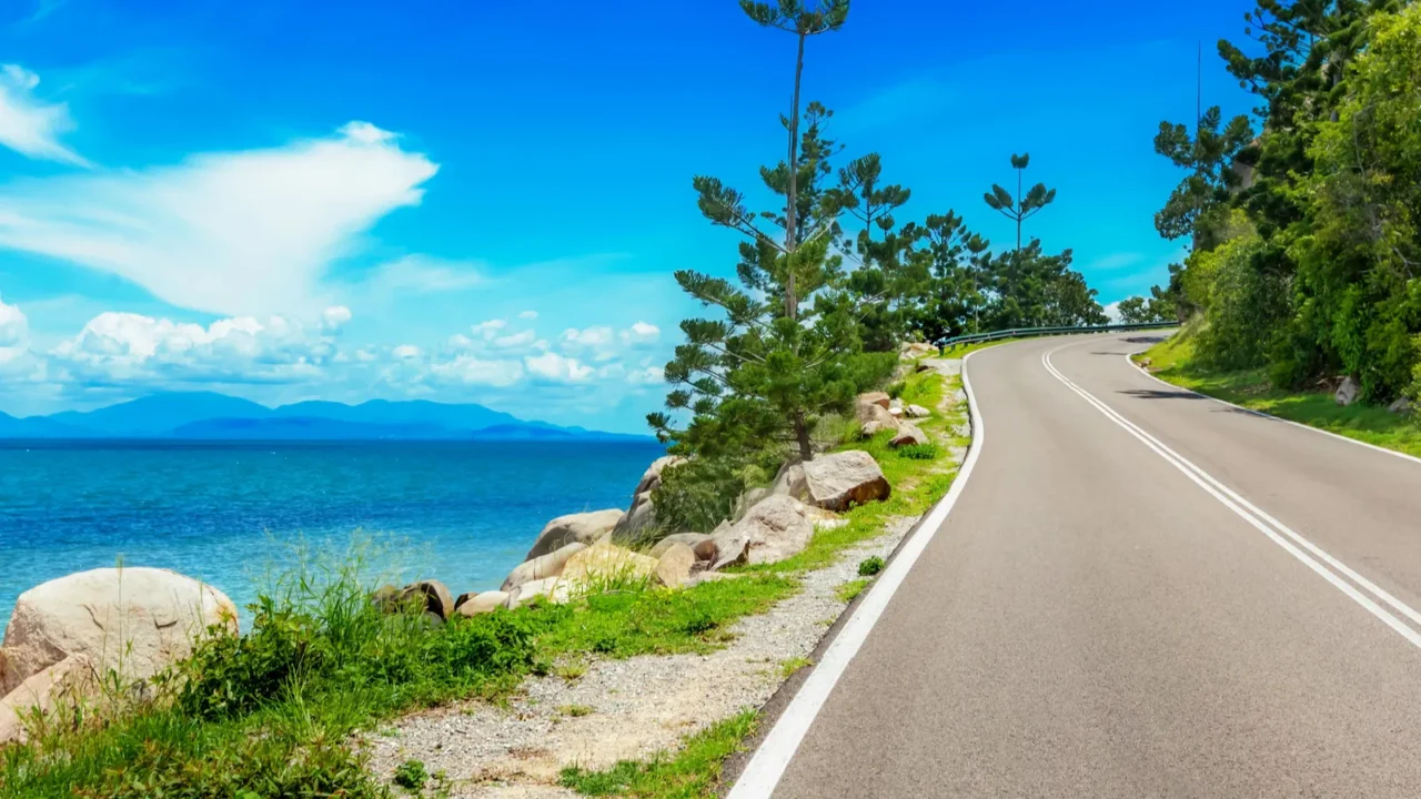 curving road along sea in magnetic island australia