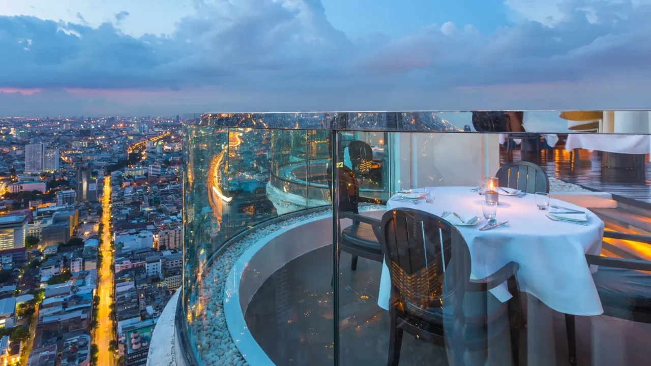 dining table with beautiful city view at twilight scene