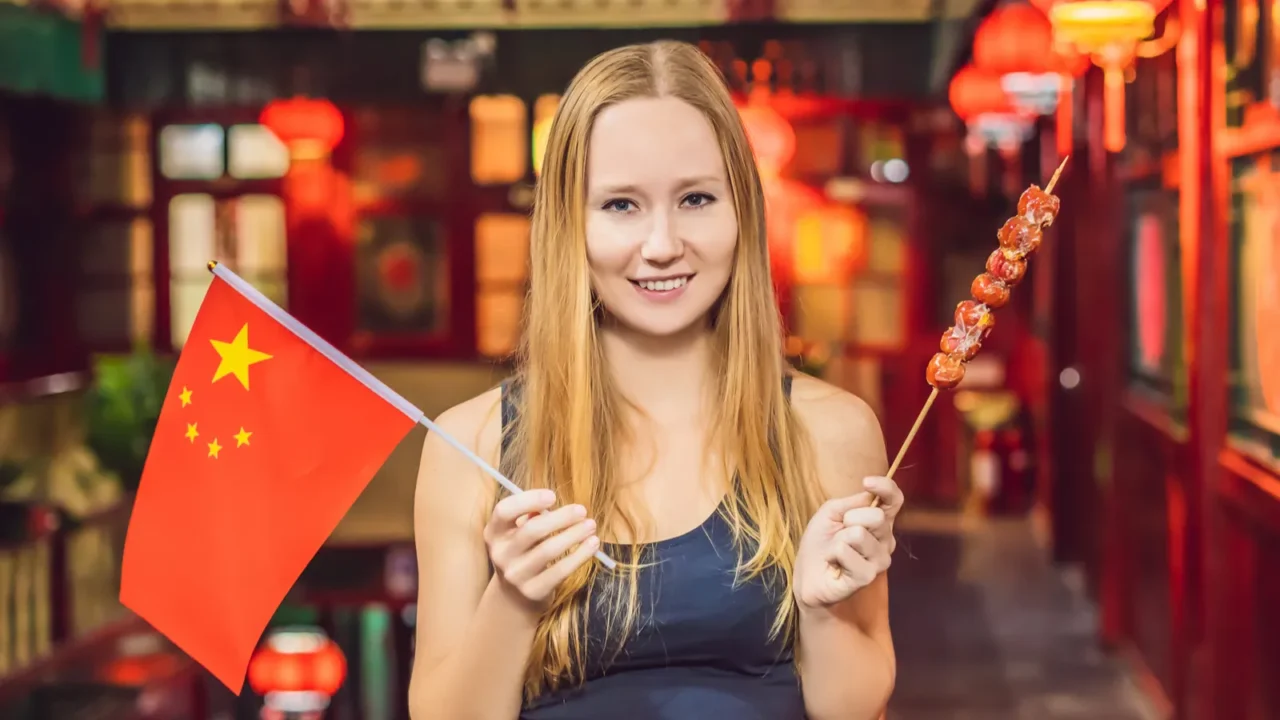 enjoying vacation in china happy woman tourist with a chinese