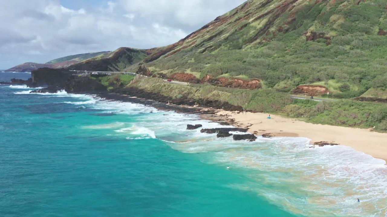 flight over rocky coast of tropical island of oahu hawaii