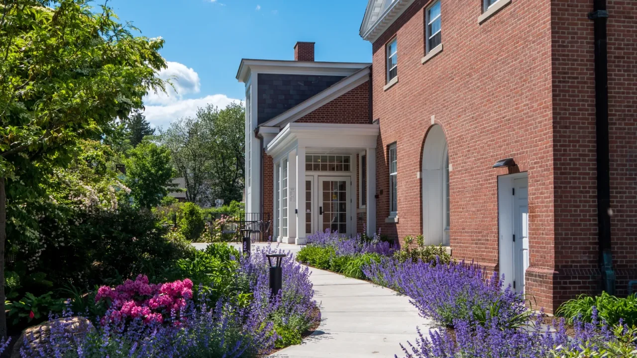 garden path by brick building