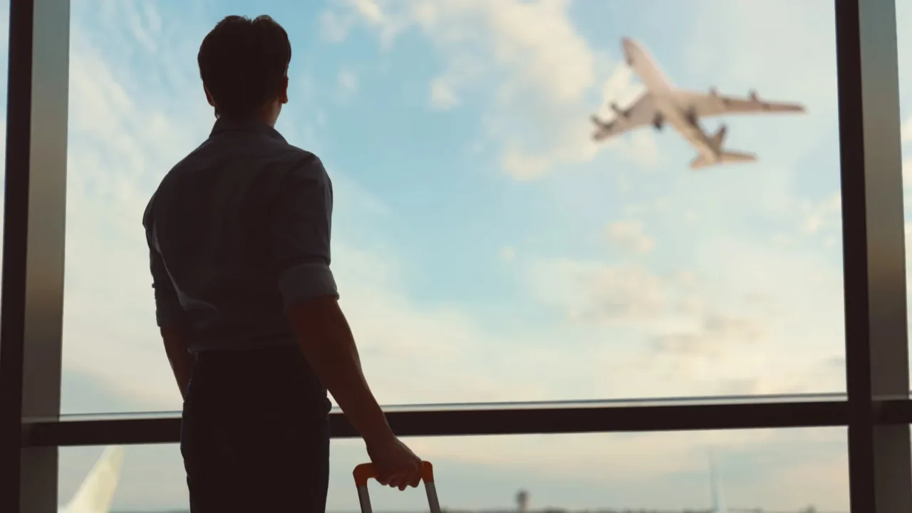 go on an adventure young man looking at a plane