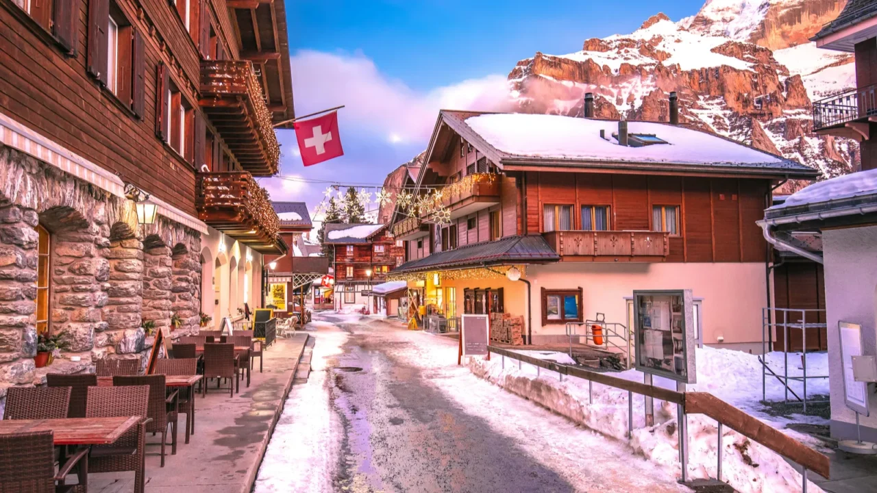 Idyllic Alpine village of Murren street sundown view, Berner Oberland region of Switzerland.