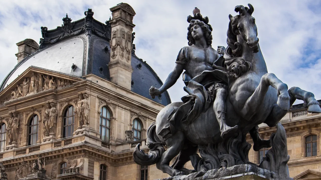 louis xiv statue at louvre museum courtyard paris france