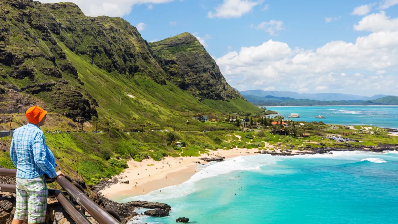 man looking at beautiful landscapes in oahu island hawaii