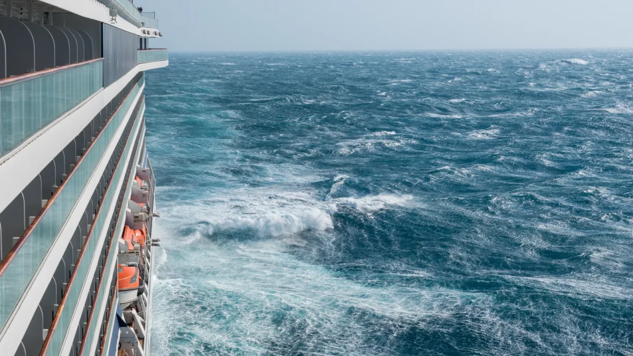 modern cruise ship traveling through rough seas