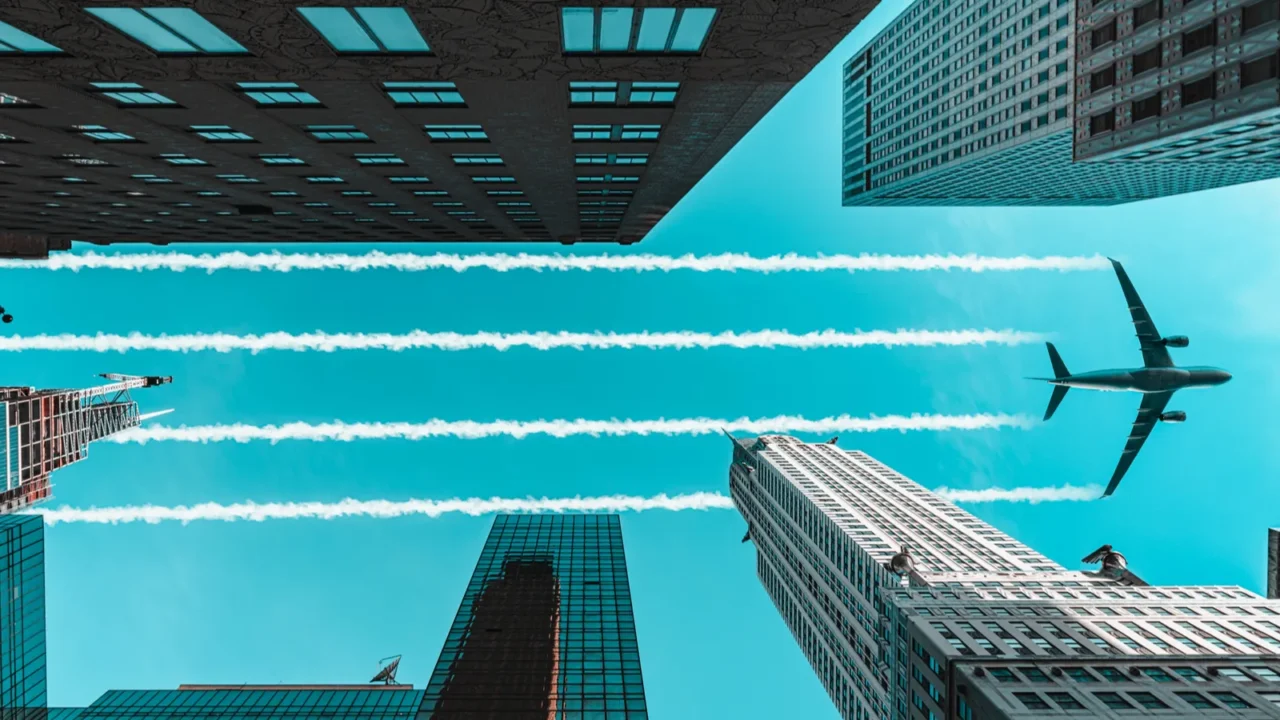 new york city midtown office skyscrappers buildings and an airplane