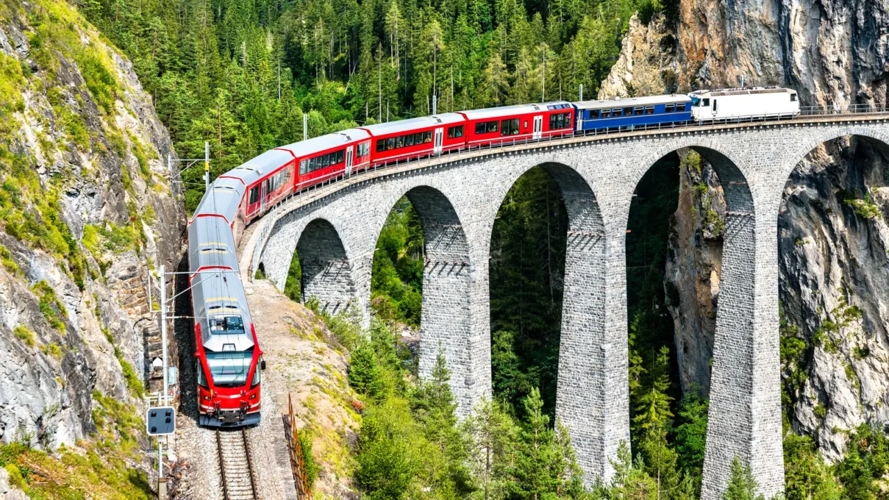 passenger train crossing the landwasser viaduct in switzerland