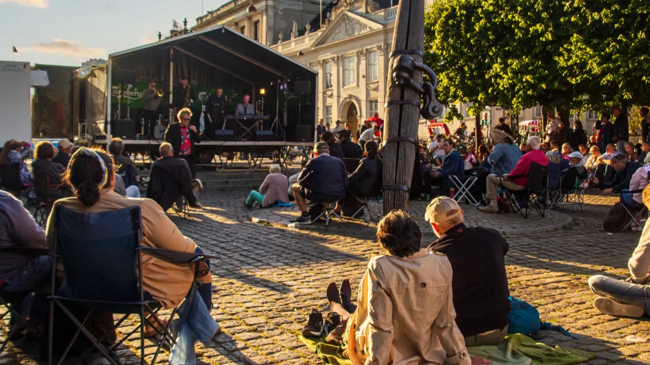 people enjoying an open air concert at the jazz festival