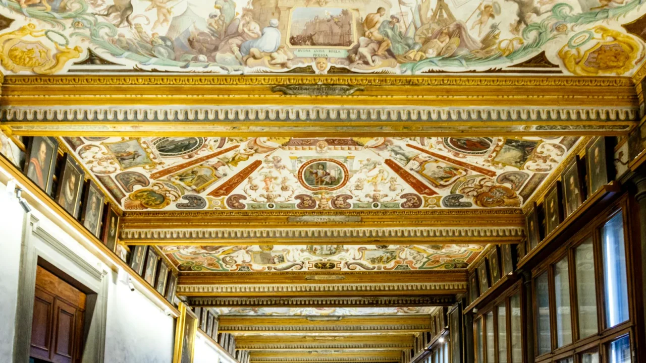 rich decorated ceiling of the uffizi gallery in florence italy