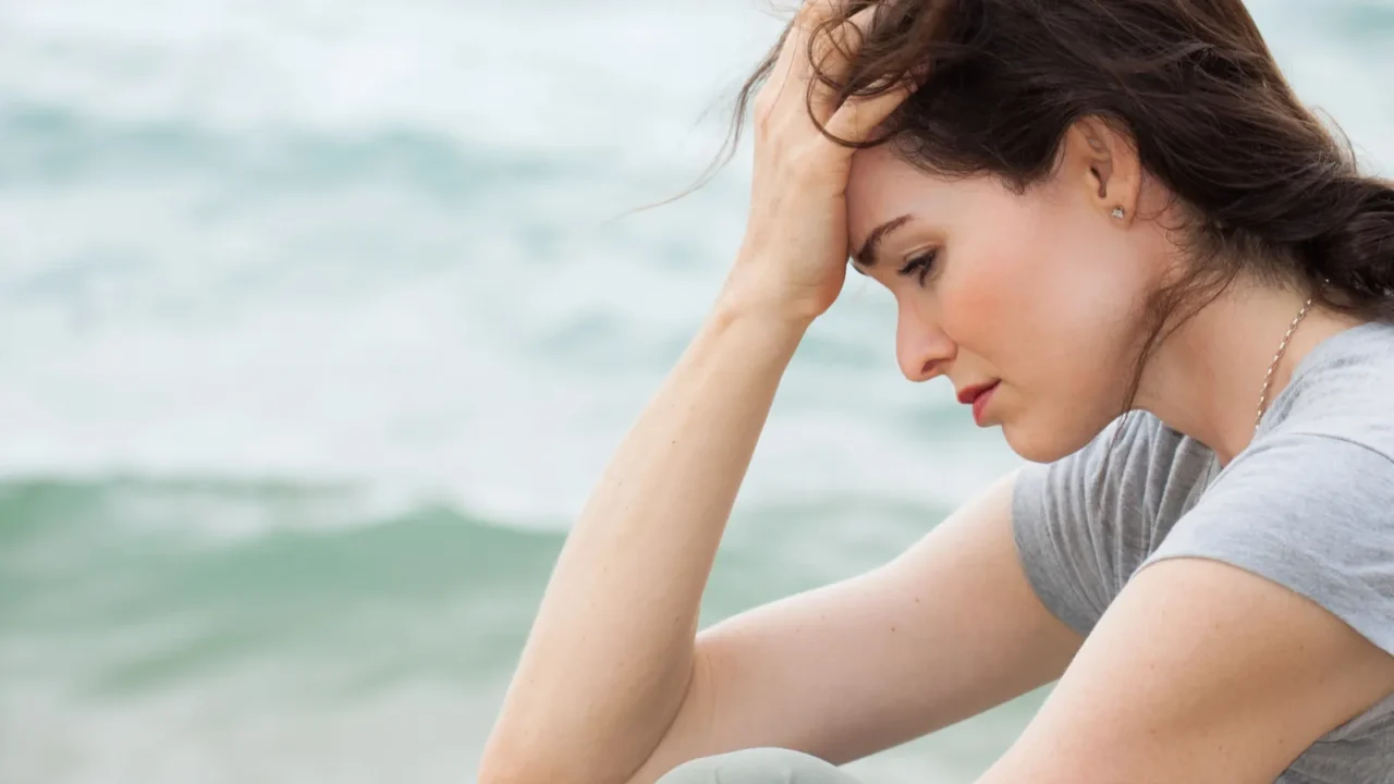 sad and upset woman deep in thought