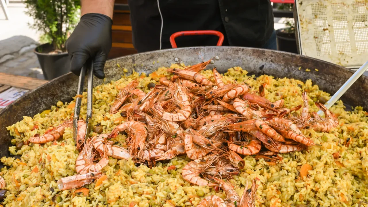 seafood paella cooked in a large pan wok street food