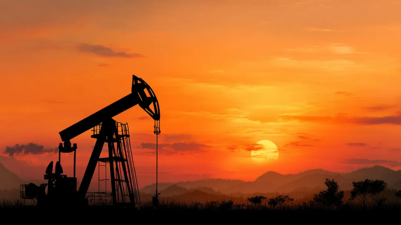 silhouette of a gas pump at sunrise