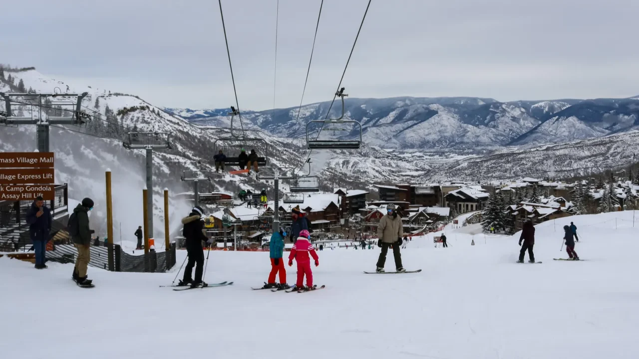skiers skiing in the aspen snowmass ski resort in colorado