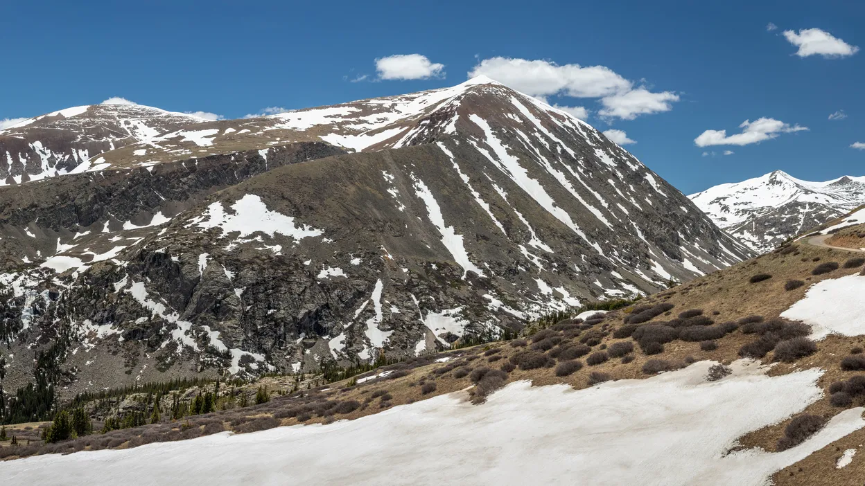stunning panoramic vista showcases snowcapped peaks of mt lincoln and