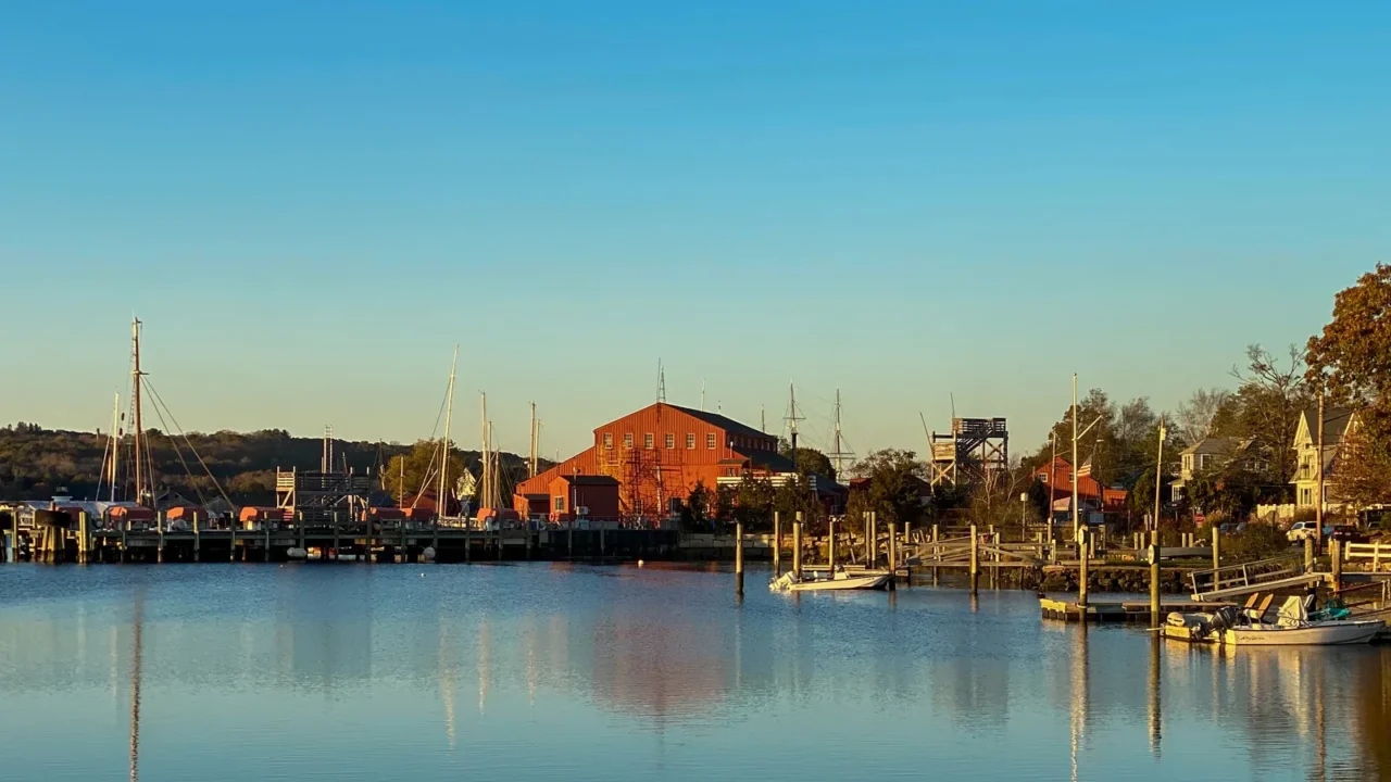 sunset along the mystic river in mystic connecticut as reflections