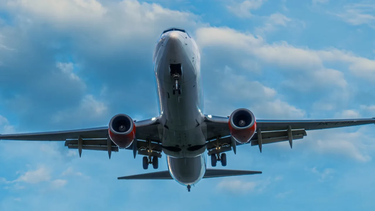 the commercial jet plane is lining up with the runway