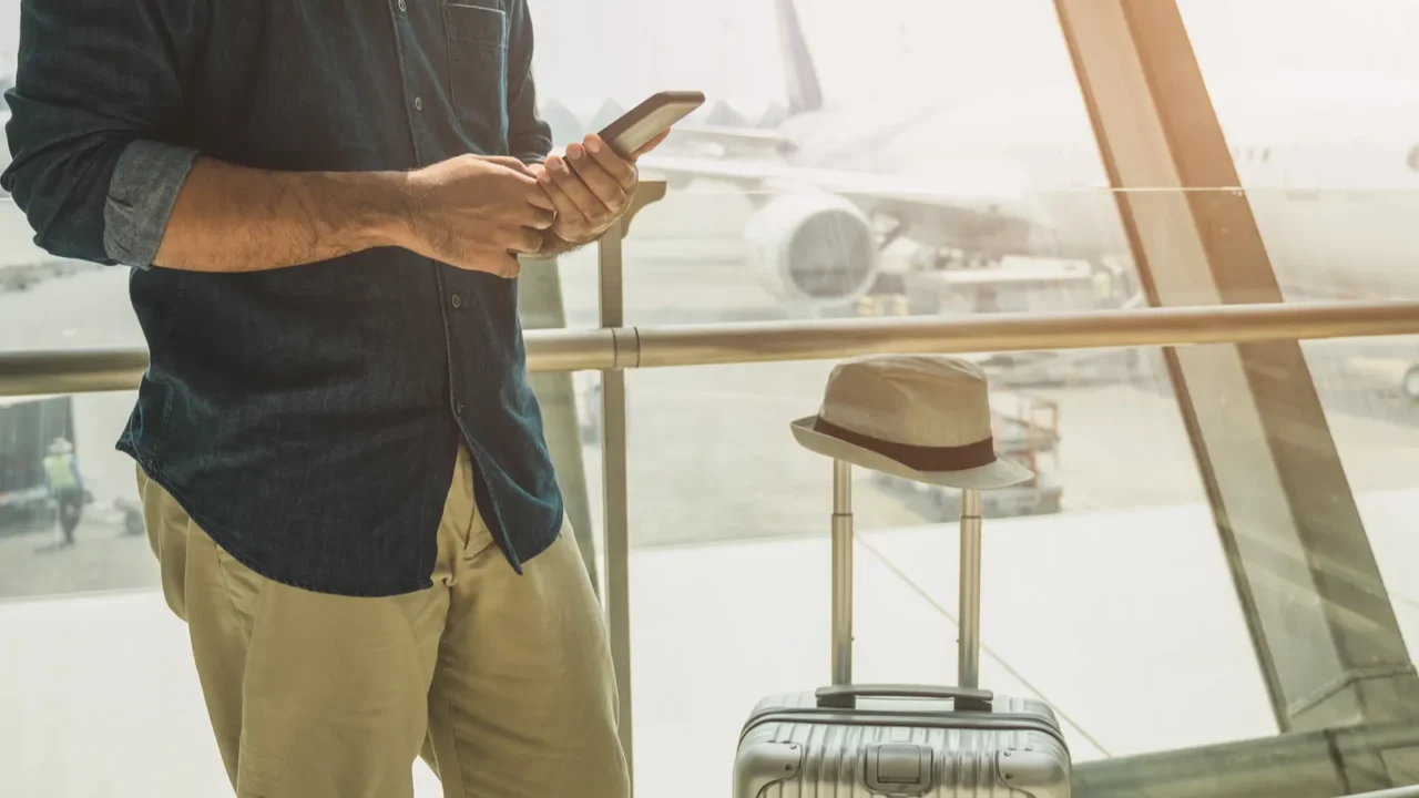 tourists are checking tour programs from their smartphones at the