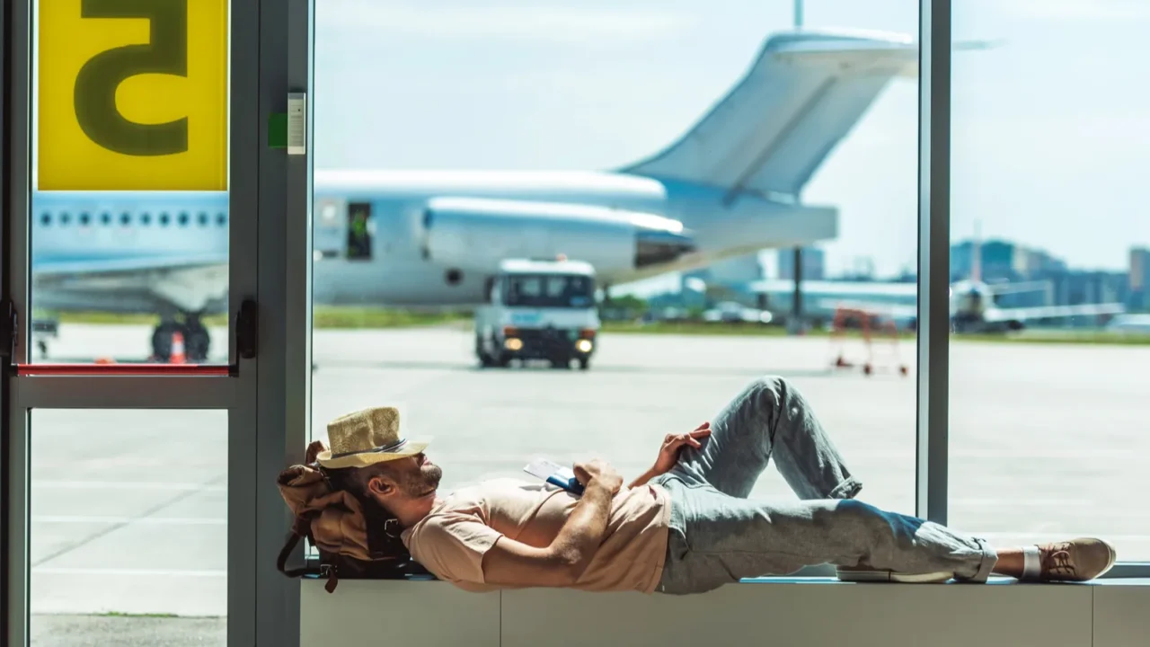 traveler sleeping in airport