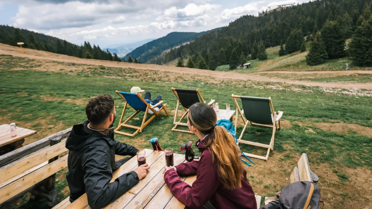 two hikers relax in a mountaintop restaurant after a hike