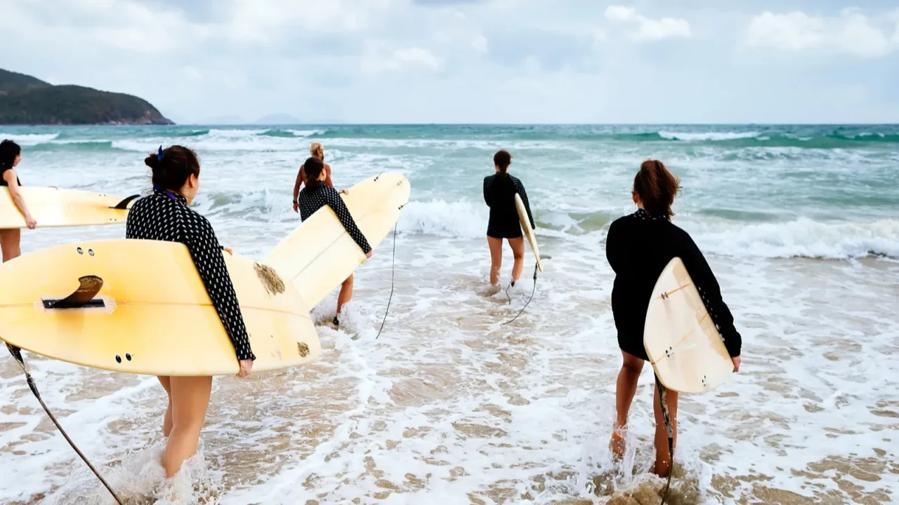 unidentified surfers with surfing boards