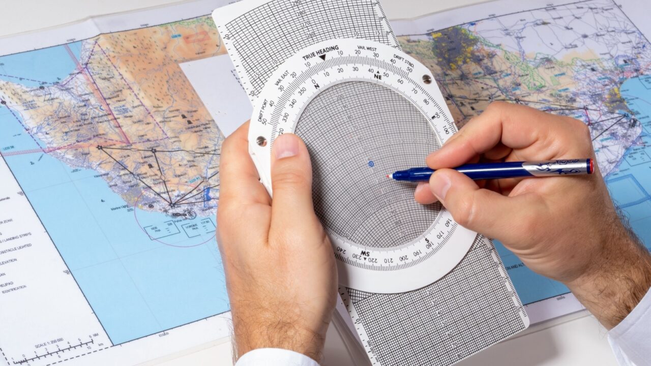 The pilot uses a navigation computer. Route calculation, drawing up a flight plan using maps. The concept of a flight school and an airline.