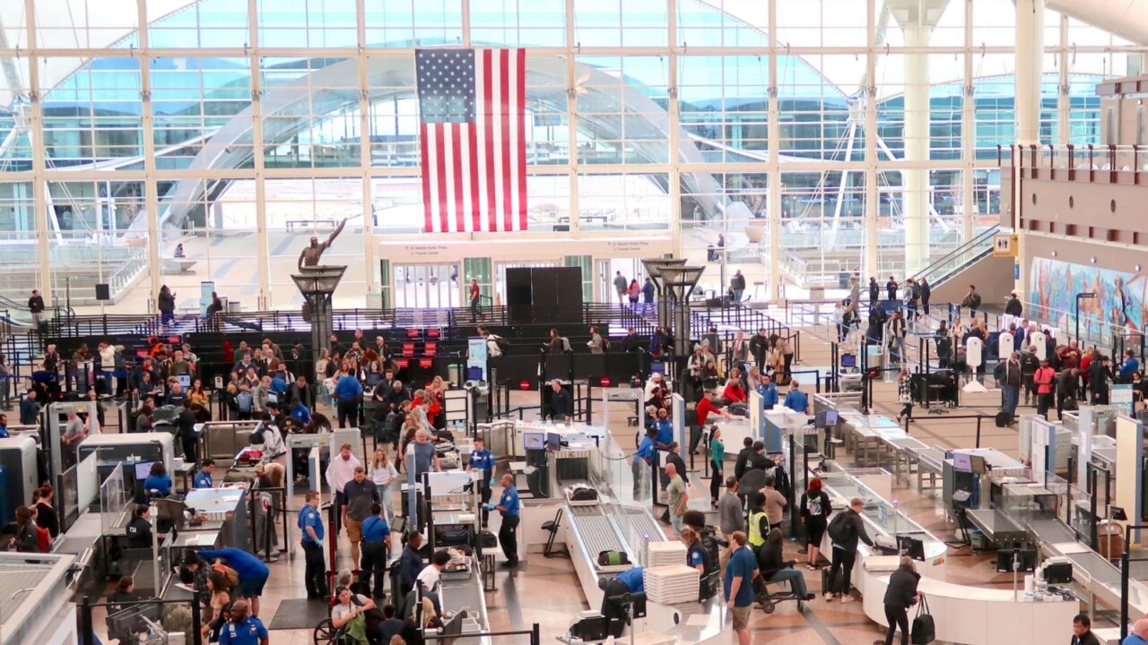 Denver, CO USA - February 2, 2024: Traveling through Denver International Airport. Airline travel. Looking down on TSA security lines. Screen passengers. Follow the rules.
