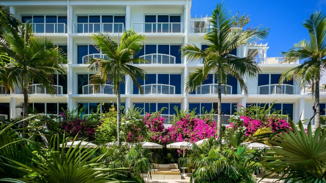 Grand Cayman, Cayman Islands, Aug 5th 2023, view of the area around the swimming pool at Palm Heights, a boutique hotel on Seven Mile Beach
