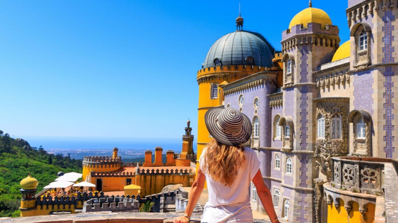 tour tourism in Sintra- Woman tourist enjoying view of Pena castle