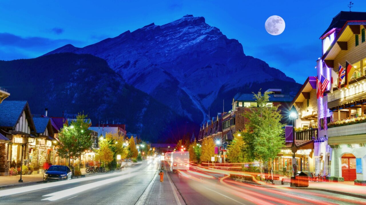 Street view of famous Banff Avenue at twilight time. Banff is a resort town and one of Canada's most popular tourist destinations.