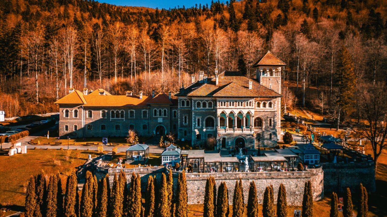 Top aerial drone view of Cantacuzino Castle in Busteni, Romania. Southern Carpathians Mountains, Transylvania.