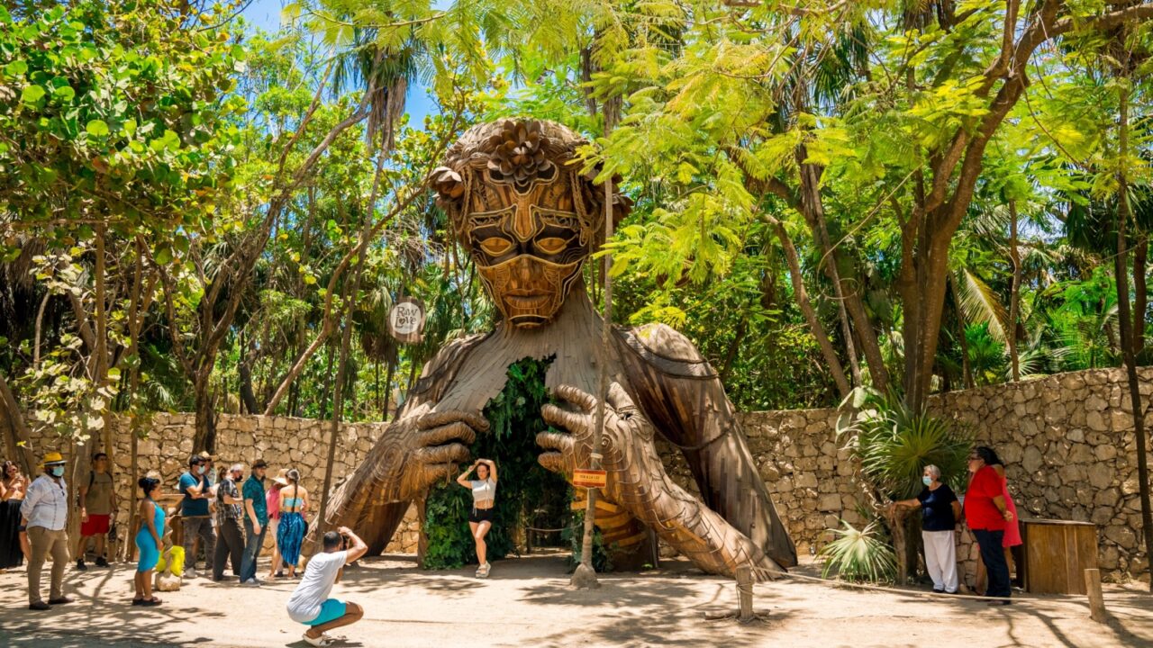 Tulum, Mexico. May 20, 2021.Beautiful towering wooden sculpture called "Ven a La Luz" welcomes guests onto the beach at Ahau Tulum in Mexico.